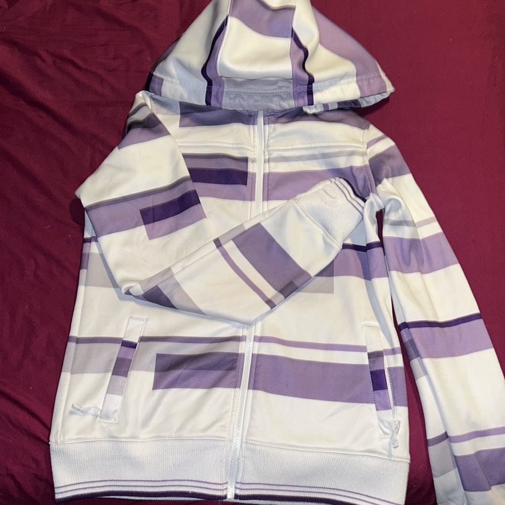Jacket from Zumiez, has removable hoodie and has thumb holes.